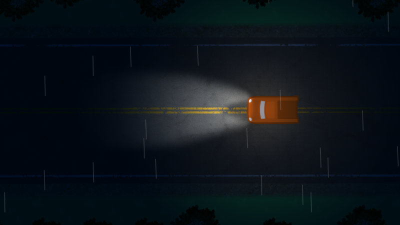 Screenshot from the game. An orange pickup truck's headlights scatter light across a paved two-lane road through the rain and darkness.